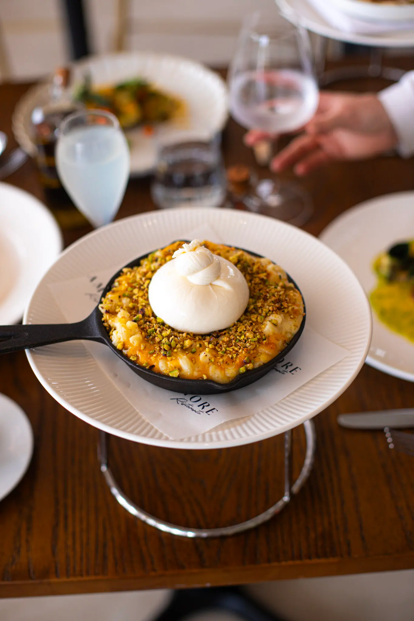 Fired cooked Italian pizza with a cocktail